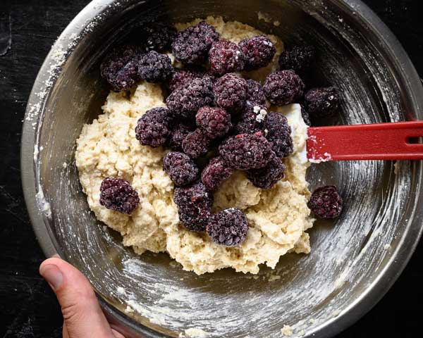 Adding blackberries to the scones