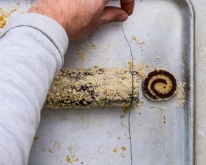 cutting shortbread roll into cookies